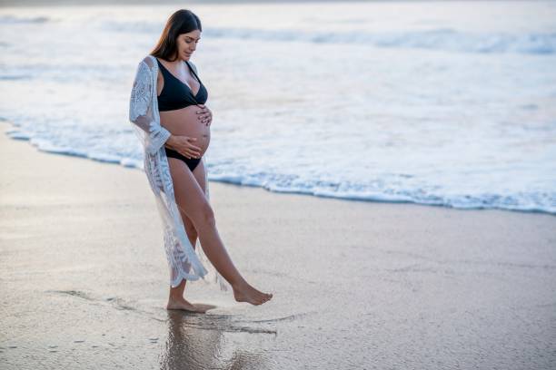 Pregnant woman enjoying the beach