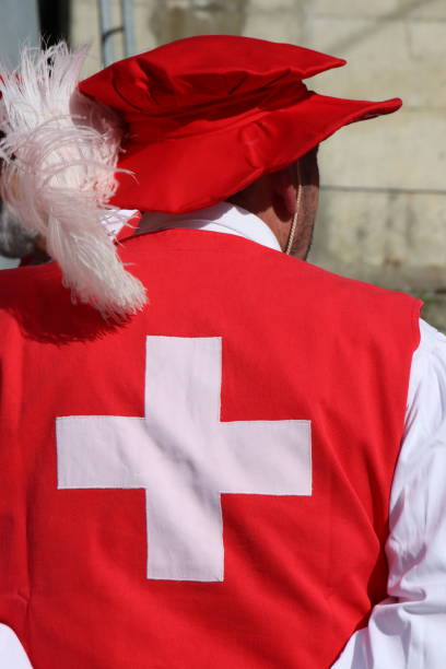 shield with red cross and great sword and Templar knight helmet