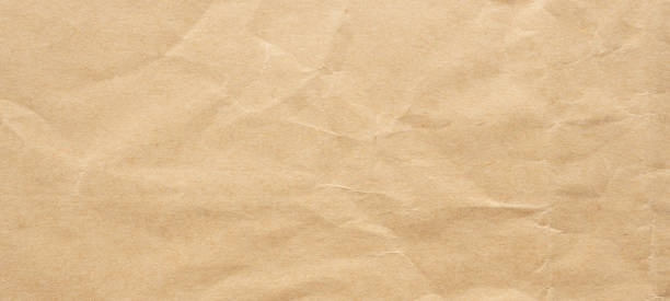 istock Abstract crumpled and creased recycle brown paper texture background 2190304292