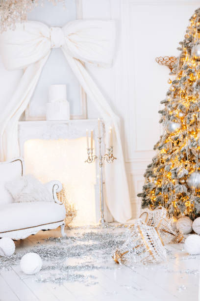 istock Festive winter setting with Christmas tree and beautifully wrapped gift boxes 2190305320