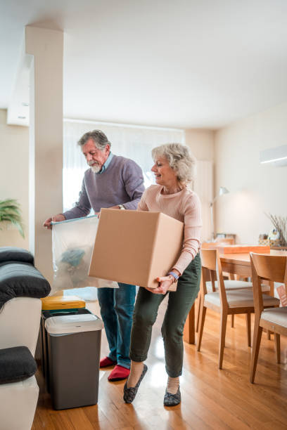istock Elderly Couple Engaged in Home Recycling 2190306217