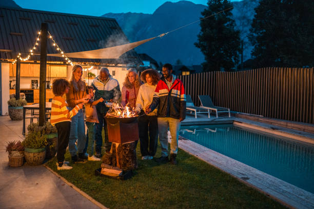 istock Multigenerational Family Enjoying Evening by the Pool 2190306233