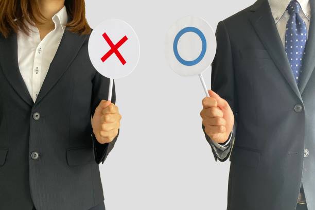 istock Business men and women with right or wrong options 2190312784