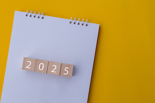 Close Up Top View Wood Cube With 2025 Number Of New Year On White Close Up Top View Wood Cube With 2025 Number Of New Year On White