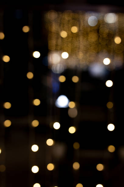 istock Blurred christmas lights creating festive bokeh effect in the dark 2190314757