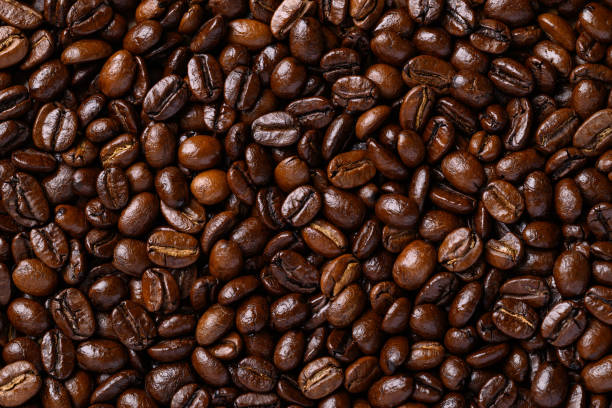 istock Dark roasted coffee beans background, Arabica coffee 2190327051