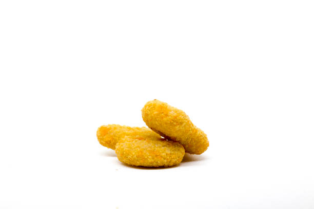 istock Golden crispy chicken nuggets isolated on a clean white background. 2190327099