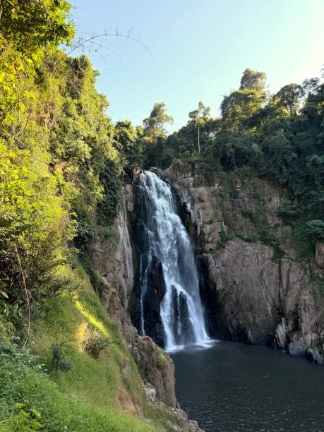 istock Majestic Waterfall cascading down rocky cliffs in lush forest 2190327476