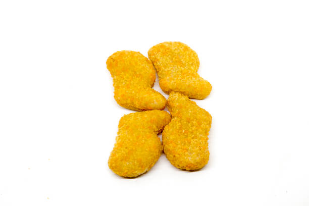 istock Golden crispy chicken nuggets isolated on a clean white background. 2190328301