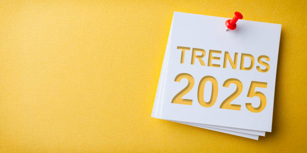 istock Trends 2025 Word in White Sticky Note on Yellow Cardboard Background 2190332077