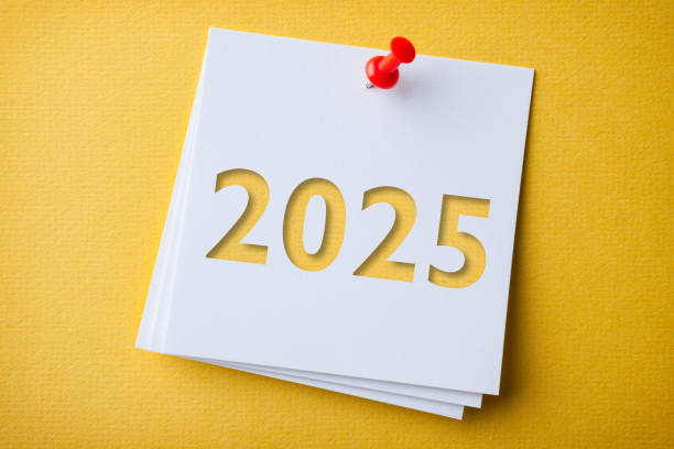istock White Sticky Note With Happy New Year 2025 And Red Push Pin On Yellow Cardboard Background 2190332081