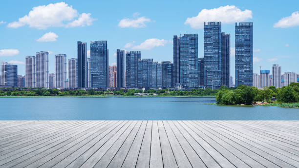 istock Empty boardwalk with modern urban skyline and sunny blue sky background 2190332085