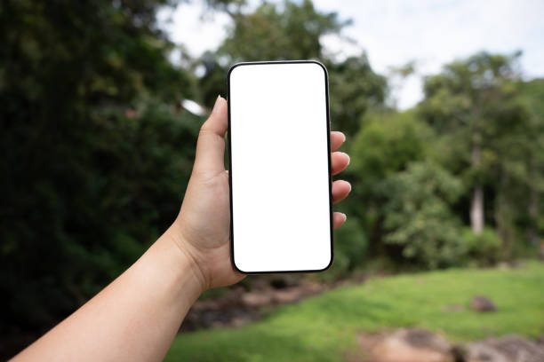 istock Smart phone mockup. Women hands holding cell telephone blank copy space screen smartphone blank white screen isolated technology concept. 2190332417