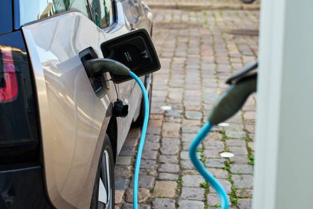 istock Electric car charging at public charging station 2190337357