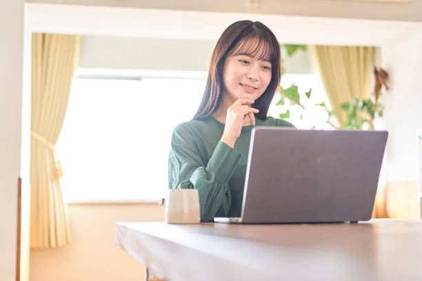 istock Young Japanese woman using a laptop 2190339901