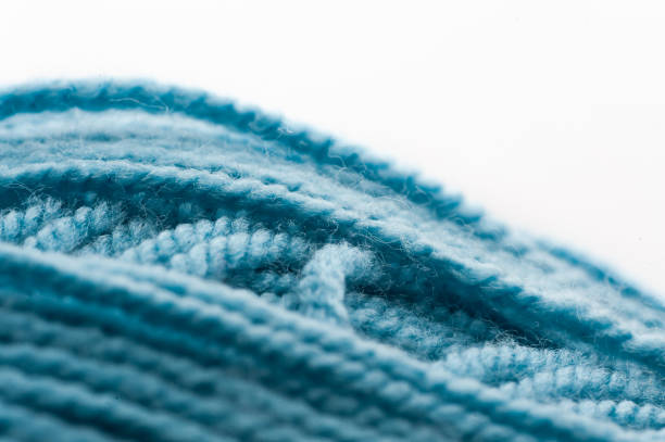 Close up of a ball of cotton knitting thread. dense fabric thread texture. selective focus