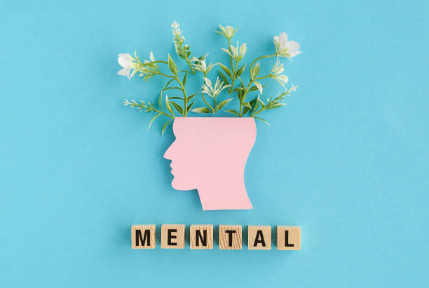 istock A head with flowers on it and the word mental written below it 2190345160