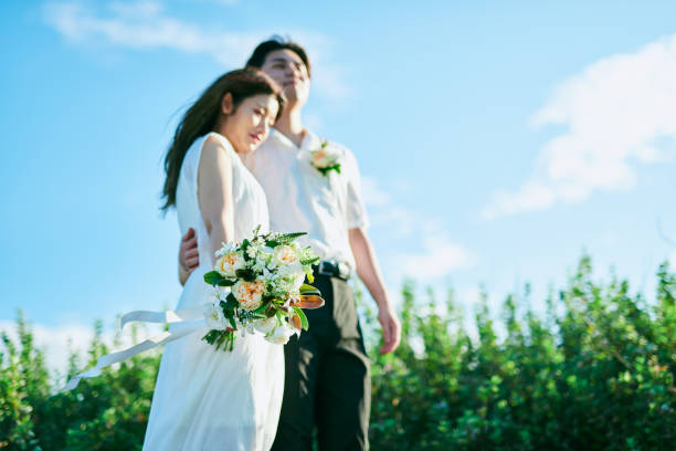 istock A wedding couple snuggling up together 2190346212
