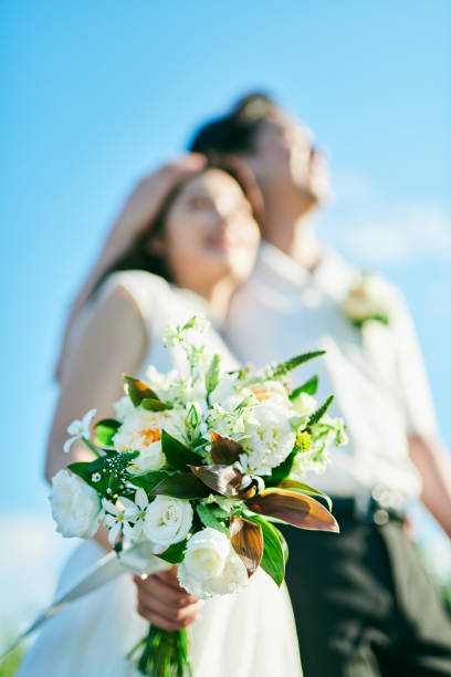 istock A wedding couple holding a bouquet 2190346353
