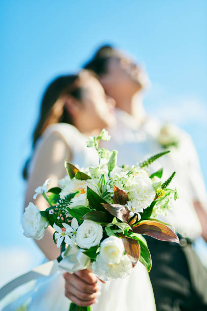 istock A wedding couple holding a bouquet 2190346398