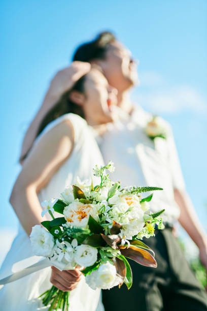 istock A wedding couple holding a bouquet 2190347041