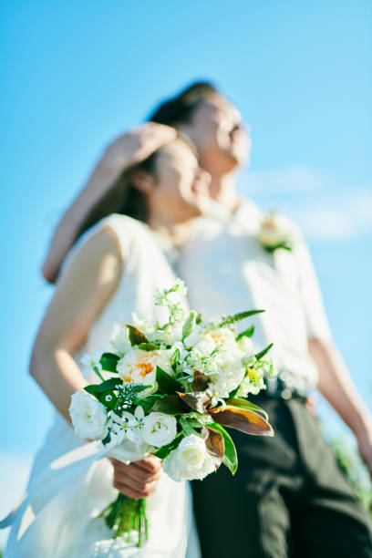 istock A wedding couple holding a bouquet 2190347069
