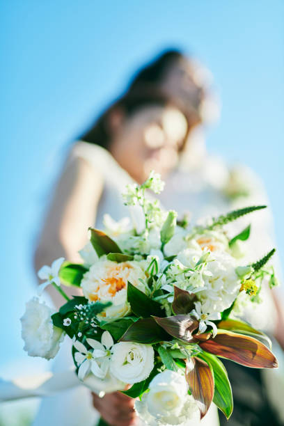 istock A wedding couple holding a bouquet 2190347132