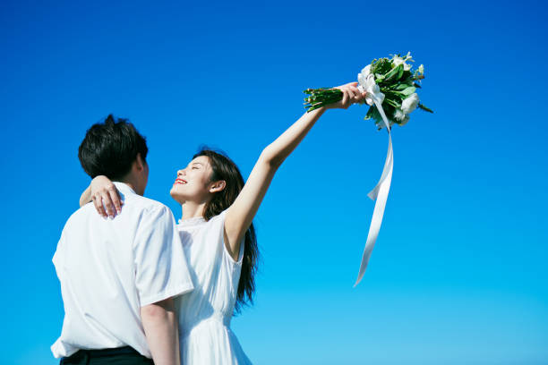 istock A wedding couple holding a bouquet 2190347866