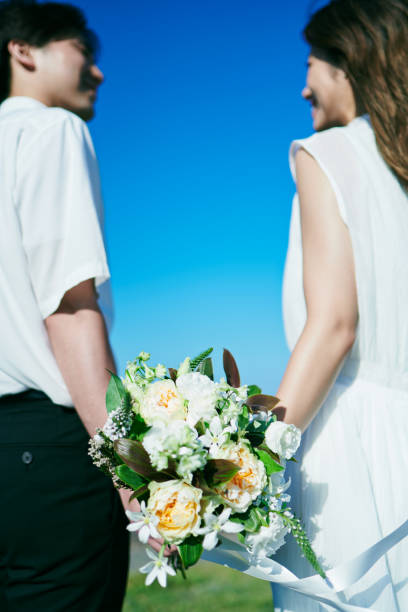 istock A wedding couple holding a bouquet 2190348840