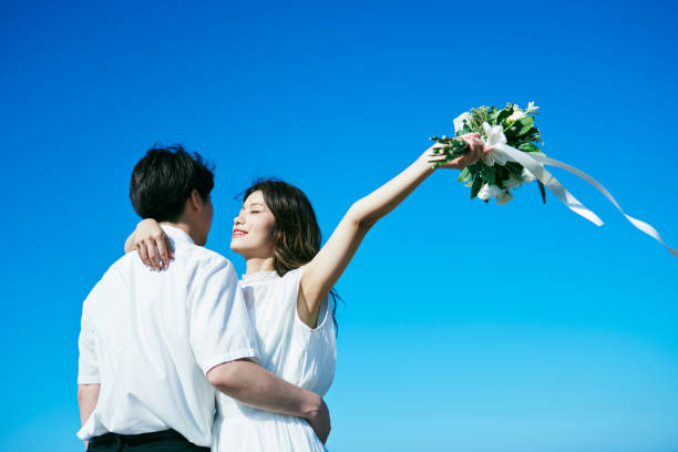 istock A wedding couple holding a bouquet 2190348932