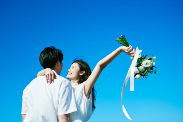 istock A wedding couple holding a bouquet 2190349043