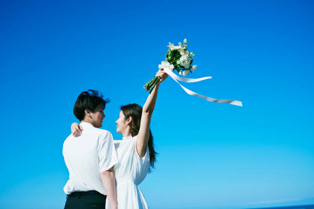 istock A wedding couple holding a bouquet 2190349098