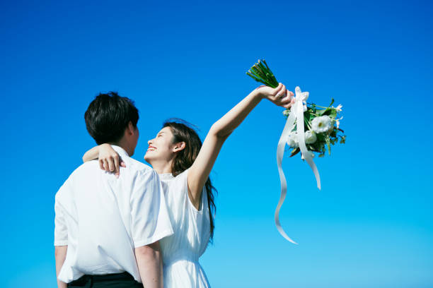 istock A wedding couple holding a bouquet 2190349468