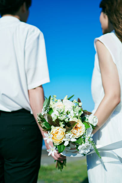 istock A wedding couple holding a bouquet 2190349544