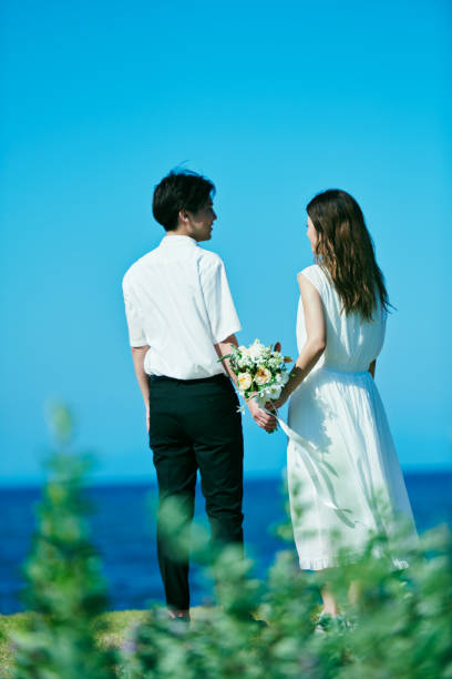 The backs of the wedding couple
