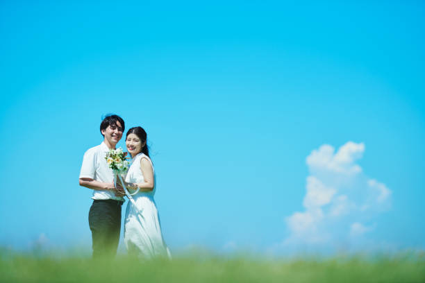 A wedding couple under the blue sky