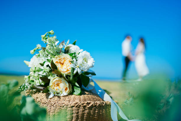 Bouquet and wedding couple