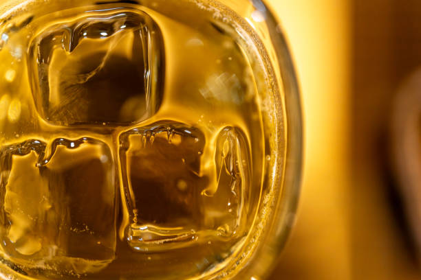 istock Close-up of Sparkling Ice Cubes in Glass 2190350120