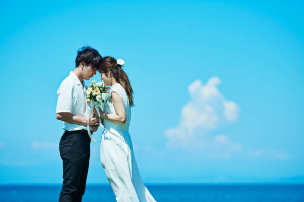 A wedding couple under the blue sky