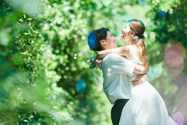 A wedding couple hugging and soap bubbles