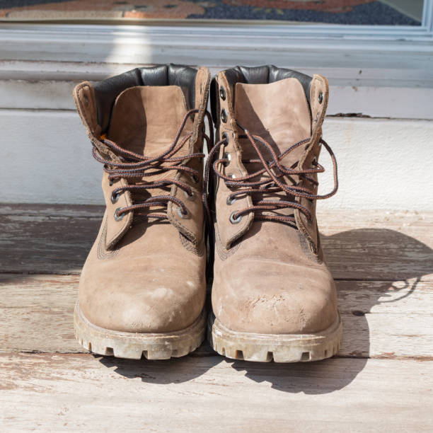 istock Leather boots home floor shoes wood 2190351502