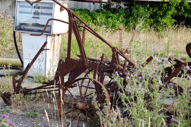 istock Vintage agricultural machine and petrol pump 2190351632