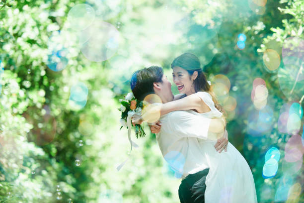 istock A wedding couple hugging and soap bubbles 2190351790