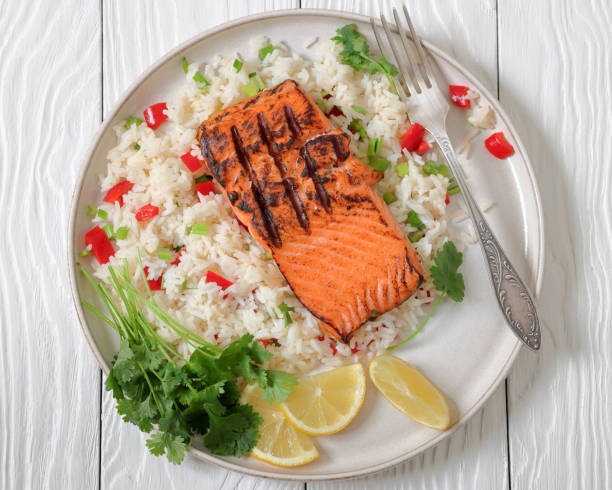 istock grilled red salmon fillet with rice, top view 2190354697