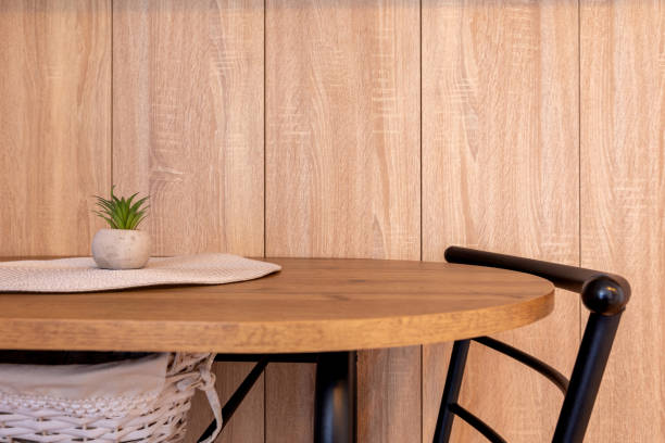 istock Modern chair at small dining table, wooden wall 2190354780