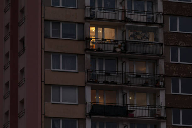 istock A tall building featuring numerous windows and balconies during the night 2190355883