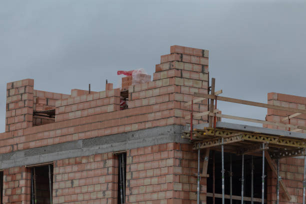 istock A new brick building is currently being constructed on a cloudy day 2190355998