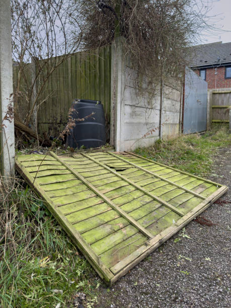 istock Fallen wooden garden fence due to storm 2190356044