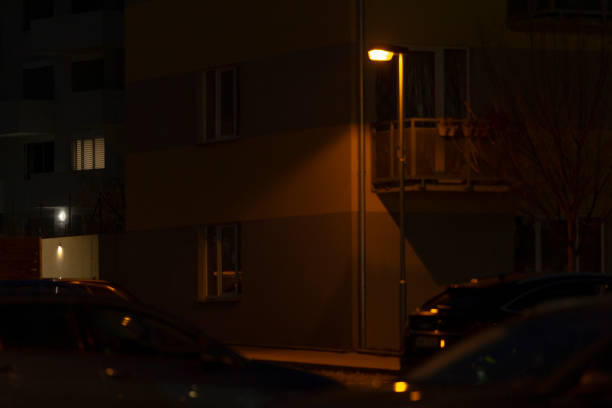 istock A street light shines brightly in front of a building during nighttime hours 2190357993