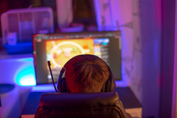 istock A person wearing headphones is enthusiastically gaming on a computer 2190359134